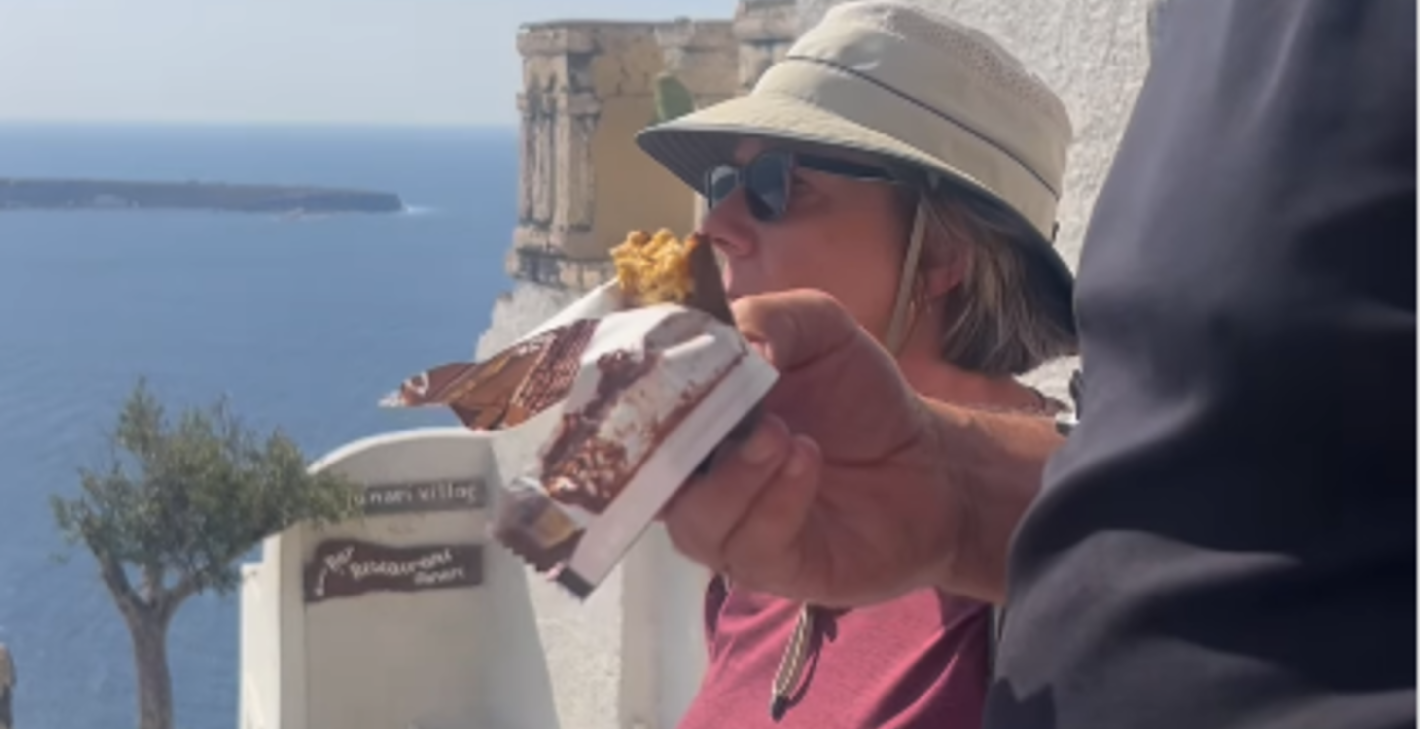 Couple's Dream Proposal Interrupted By Clueless Tourist Eating Candy Bar